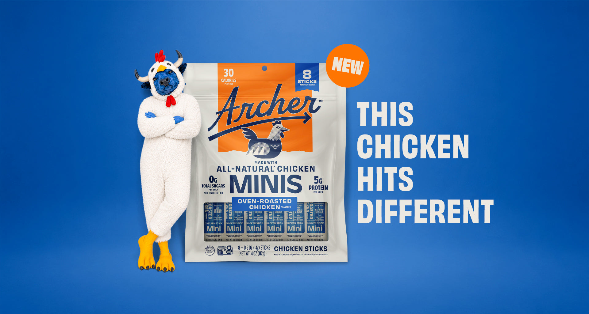 Archer mascot in a chicken costume stands next to an Archer All-Natural Chicken Minis bag — 'This Chicken Hits Different' — Shop Archer Chicken Minis